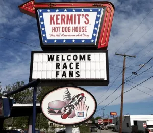 Kermit's Hot Dog House sign outside the building with a message reading "Welcome Race Fans!"