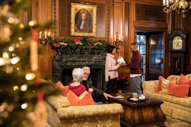 Couples in the lounge at Graylyn with holiday decorations