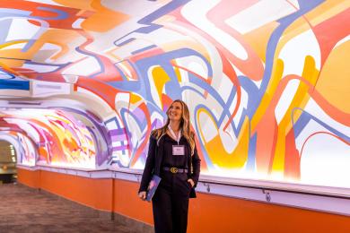 Woman in colorful hall