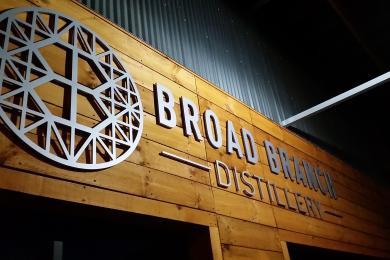 Distillery logo displayed above the entrance