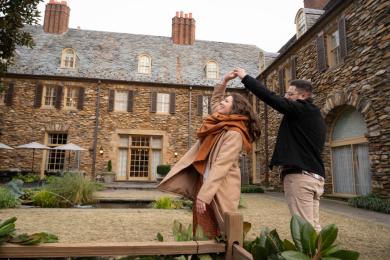 A male and female couple dances in front of the Graylyn Estate in Winston-Salem.