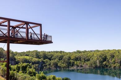 A group of people enjoy the view from the viewing platform at The Quarry at Grant Park in Winston-Salem.