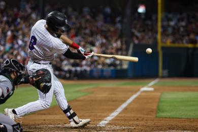 A player swings and hits the ball at a Winston-Salem Dash baseball game.
