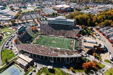 An overhead view of Allegacy Stadium at Wake Forest University, filled with fans waiting to watch a Demon Deacons football game.