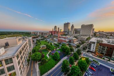An aerial view of Bailey Park, the RJ Reynolds Smokestacks, and the Innovation Quarter neighborhood of downtown Winston-Salem.