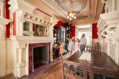 A family of four explores the inside of Körner's Folly.