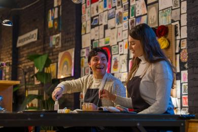 A couple makes art at Dabble Art Bar