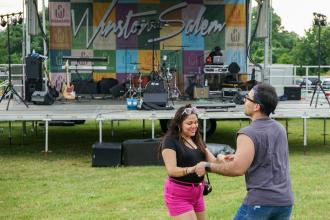 A couple dances in front of the stage at the Rock Out the Quarry event in Winston-Salem.