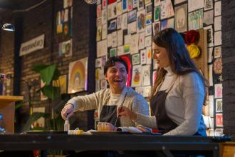 A couple makes art at Dabble Art Bar