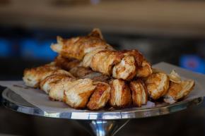A pastry stand at Wilkerson Moravian Bakery with fresh treats on display.