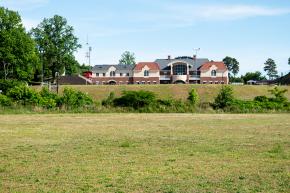 A back view of Bowman Gray Stadium as seen from the Salem Creek Greenway.